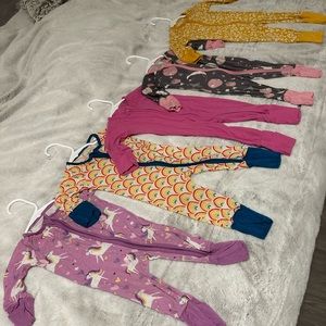 Little Sleepies -  bundle of 5 newborn zippies